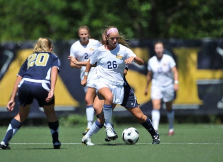 Claire wood playing soccer at GW